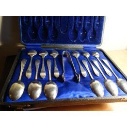 Vintage silver plated tea spoons and sugar tongs.