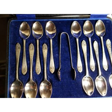 Vintage silver plated tea spoons and sugar tongs.
